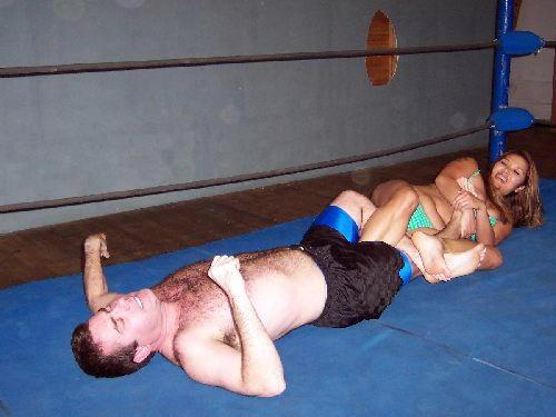 In honor of Ric Flair, Kim applies the figure 4 leglock